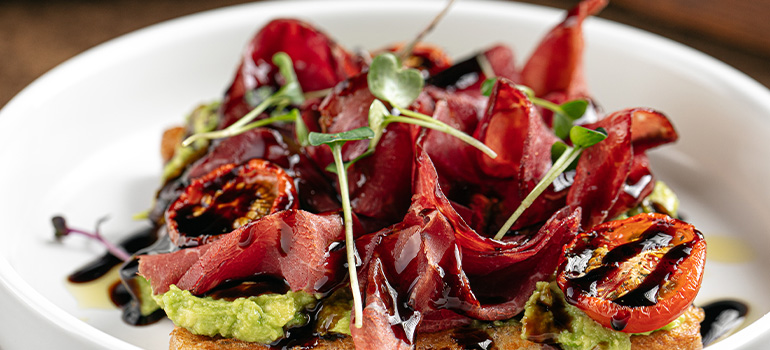 Bresaola presented on a plate